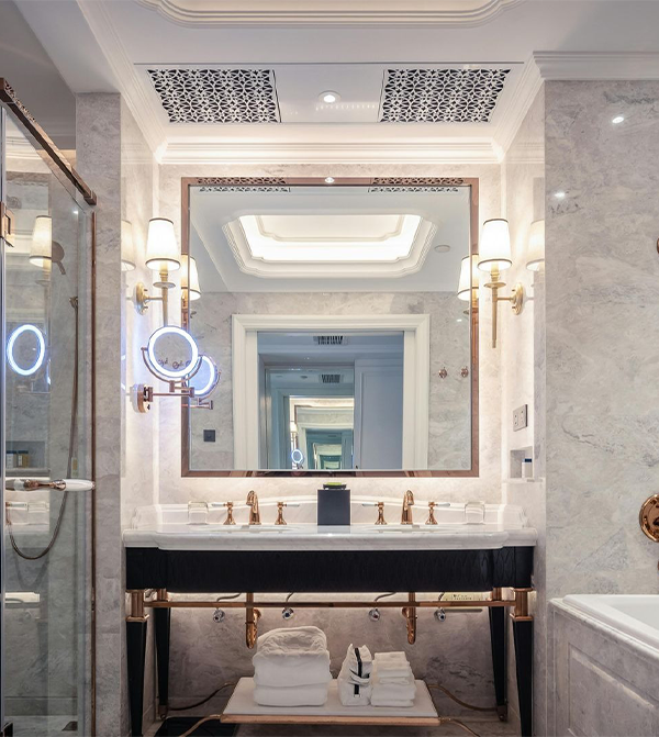 A bathroom with a bathtub and a mountain in the background