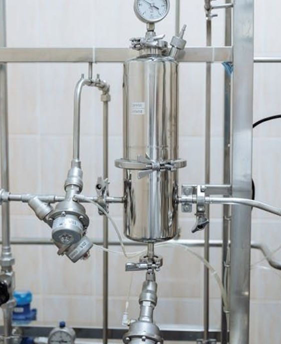 A kitchen with wooden cabinets and stainless steel appliances