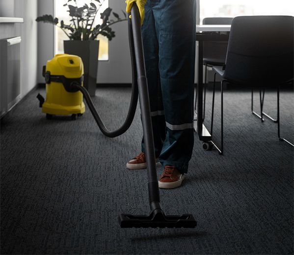 A kitchen with wooden cabinets and stainless steel appliances