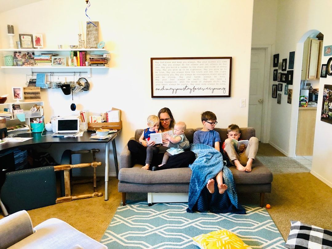 A family comfortably enjoying their living room, demonstrating improved indoor comfort due to proper insulation - spray insulation service