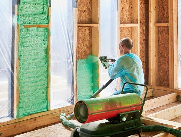 A kitchen with wooden cabinets and stainless steel appliances