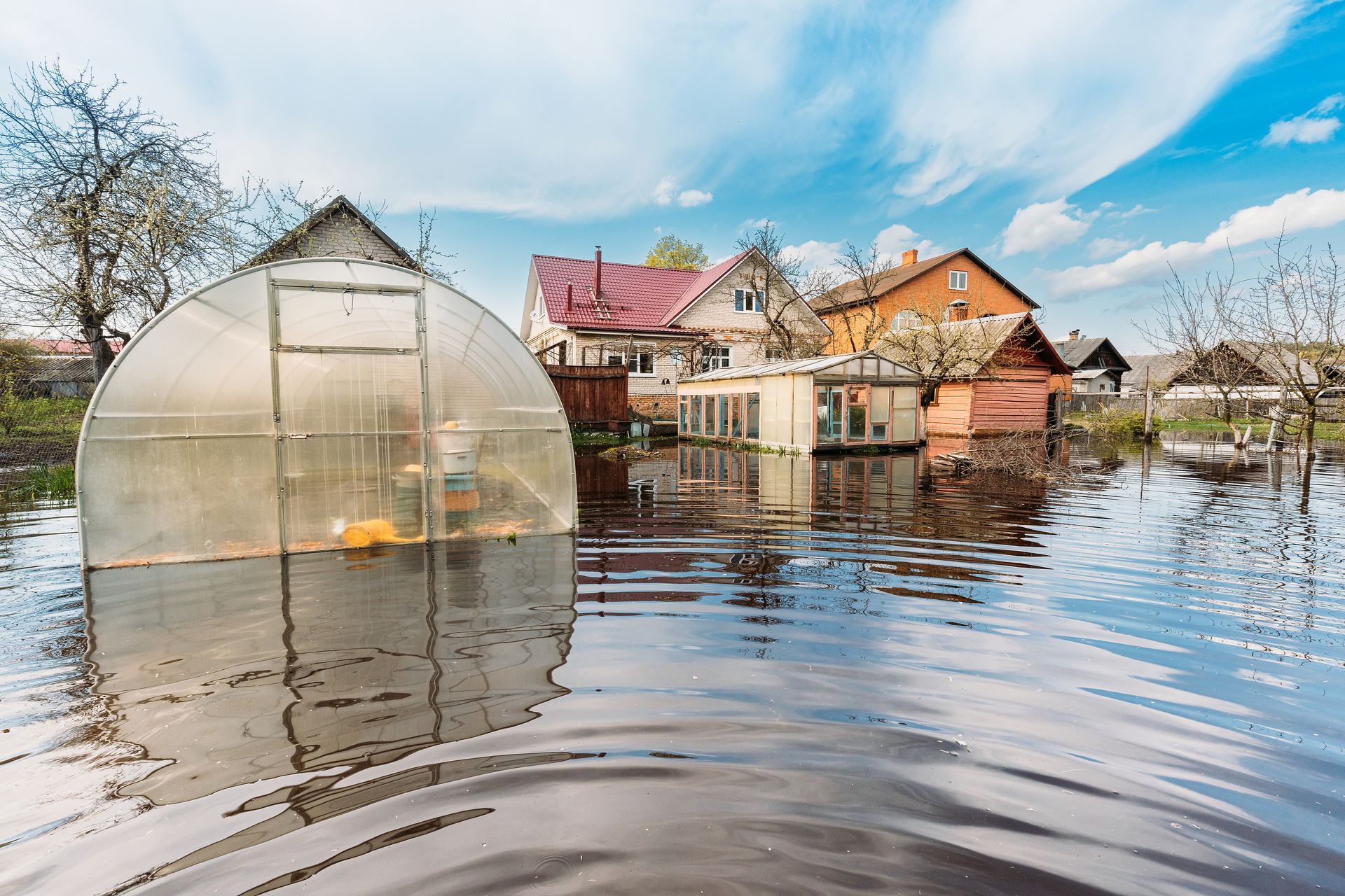 Vegetable Garden Beds In Water During Spring Flood floodwaters during natural disaster.