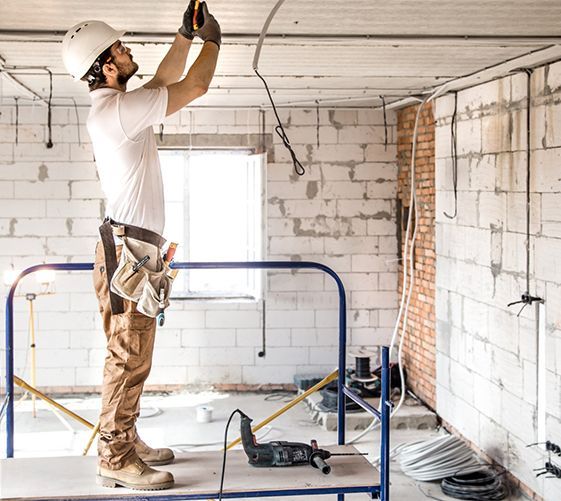 A kitchen with wooden cabinets and stainless steel appliances