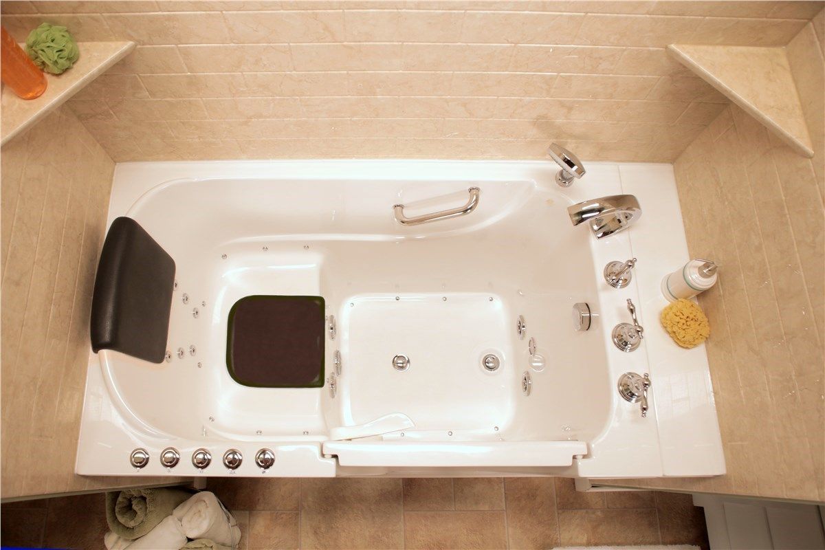 An aerial view of a walk in tub in a bathroom