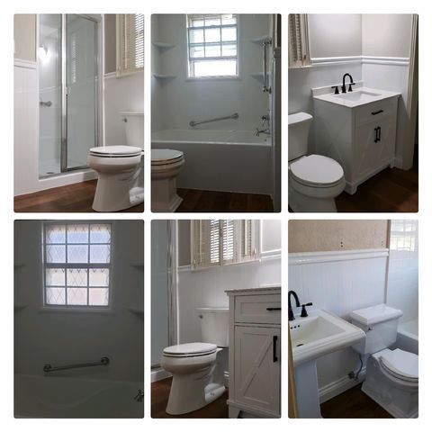 A bathroom with a toilet , sink , shower and window.