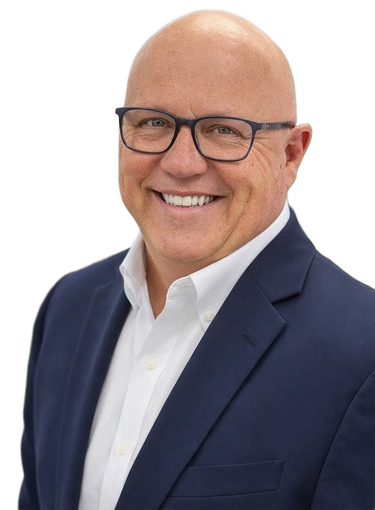 Man with bald head, glasses, and suit smiling.