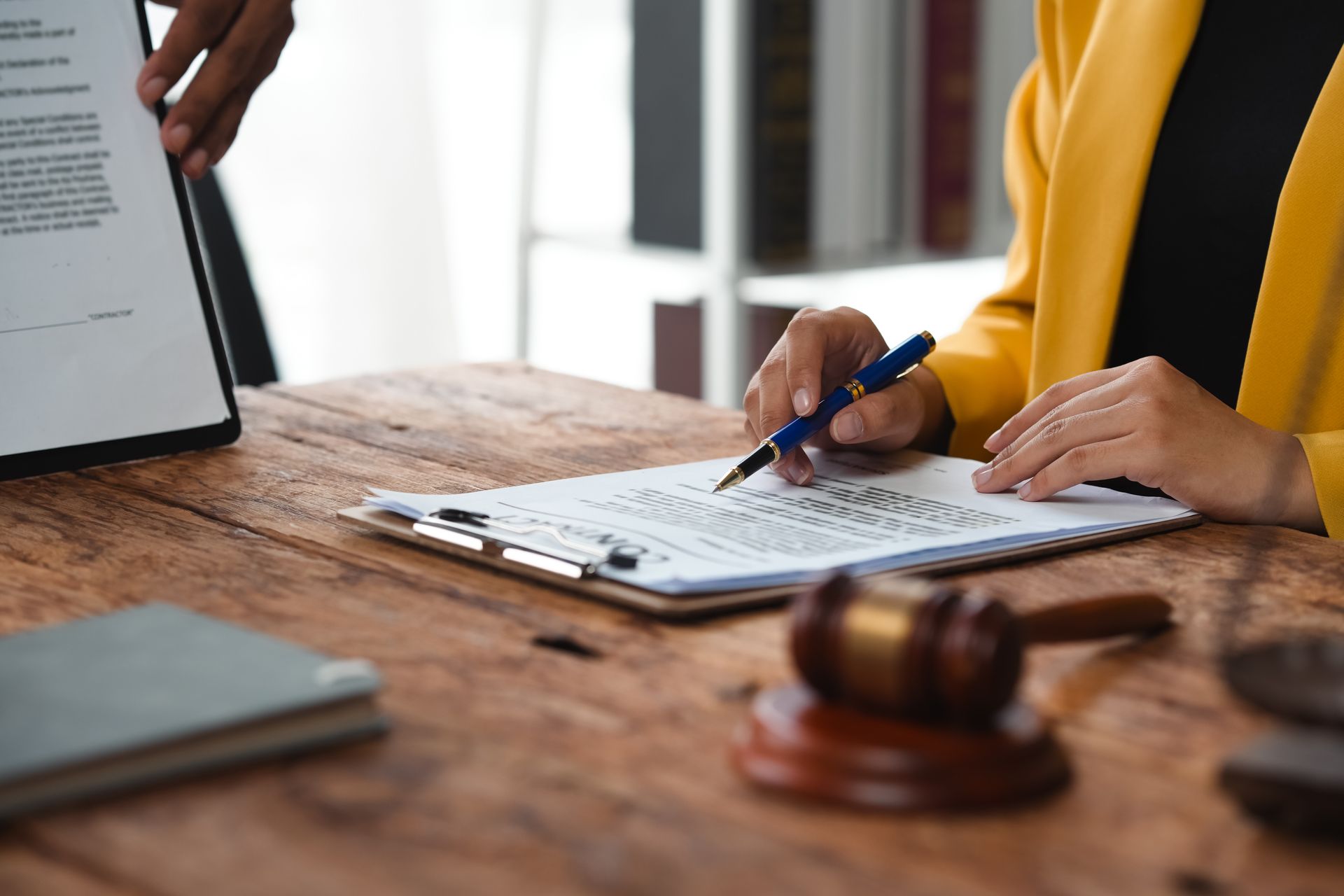 Client consulting with a personal injury attorney Client consulting with a personal injury attorney