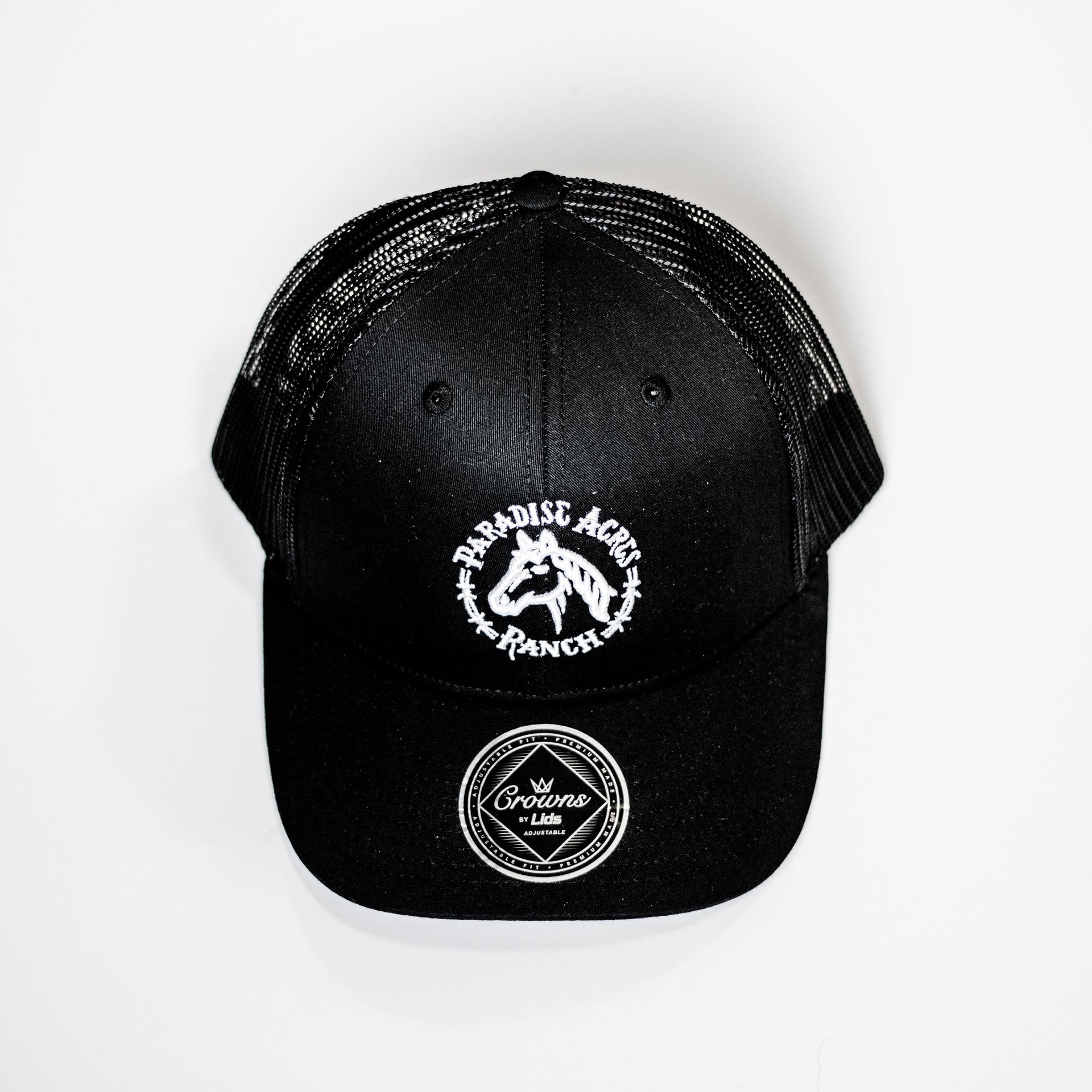 A black trucker hat with a white horse on it