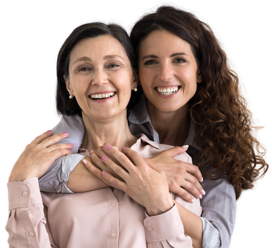 An elderly woman is smiling and holding a cane