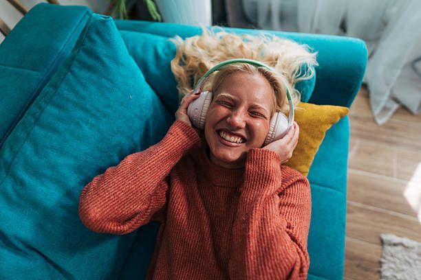 A person is holding the handle of a walker.