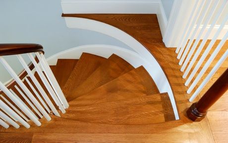 new staircase installation by arlington heights carpenters with all new white trimming / molding.