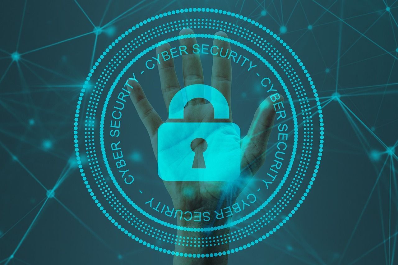 A hand is holding a padlock in a cyber security circle.