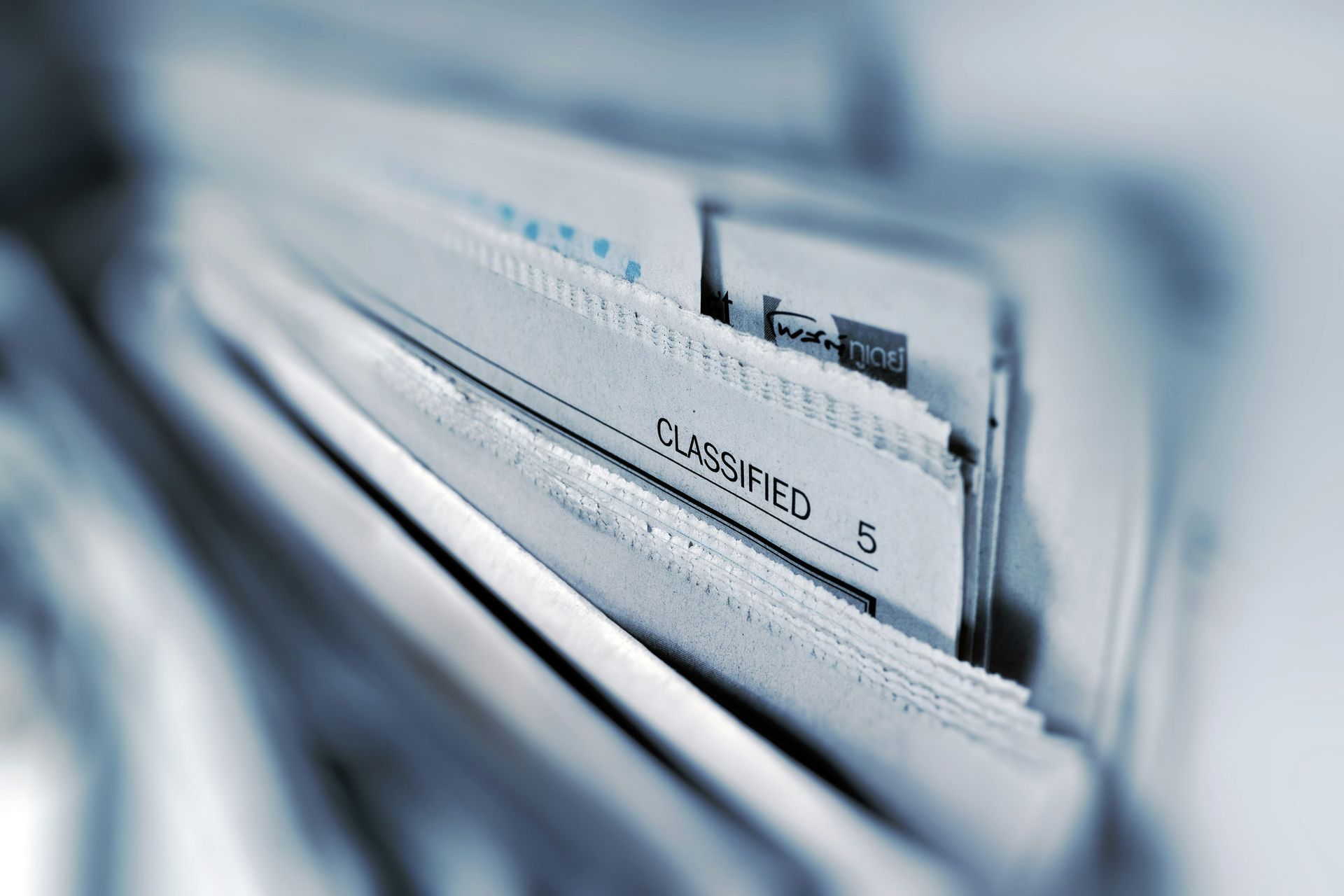 A close up of a binder with classified papers in it