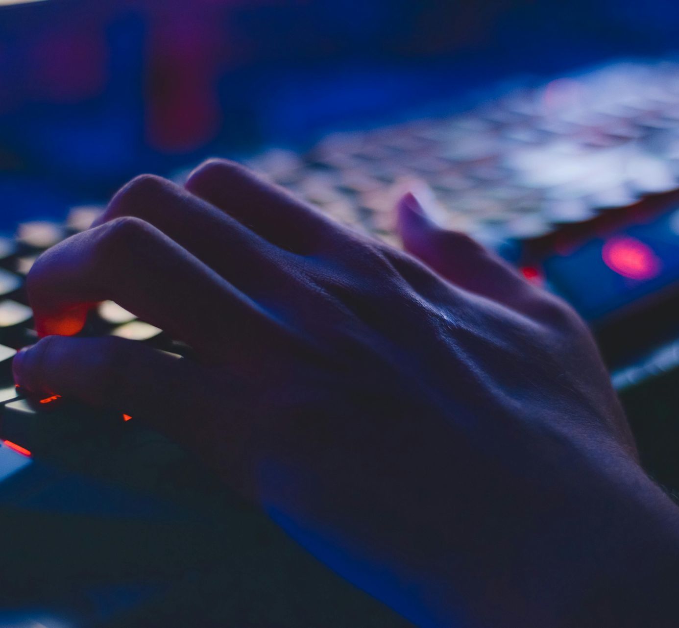 A close up of a person 's hands typing on a keyboard