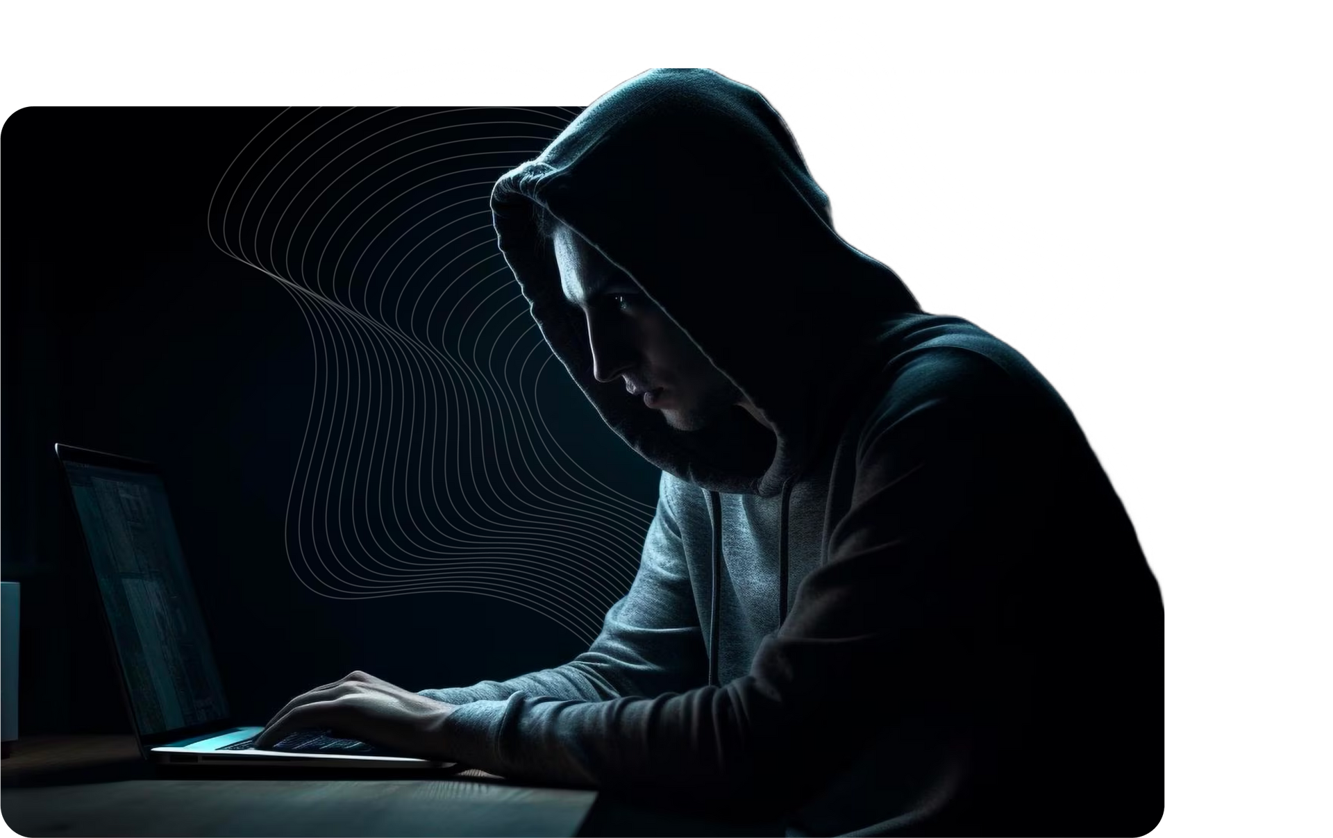A man in a hoodie is typing on a laptop computer.