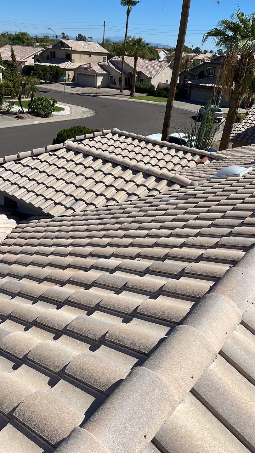 A roof with a lot of tiles on it in a residential area.