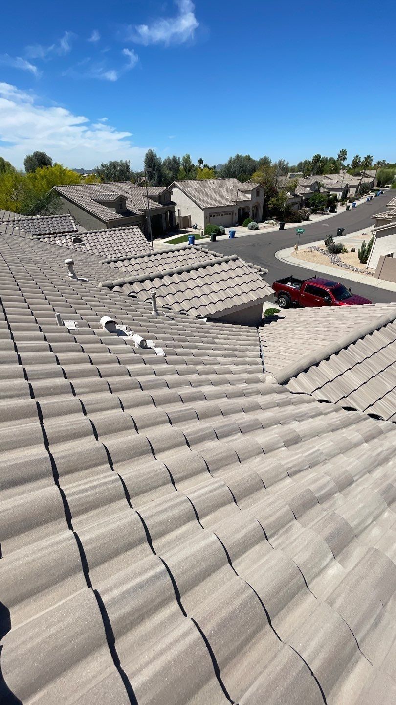 A roof with a lot of tiles on it in a residential area.