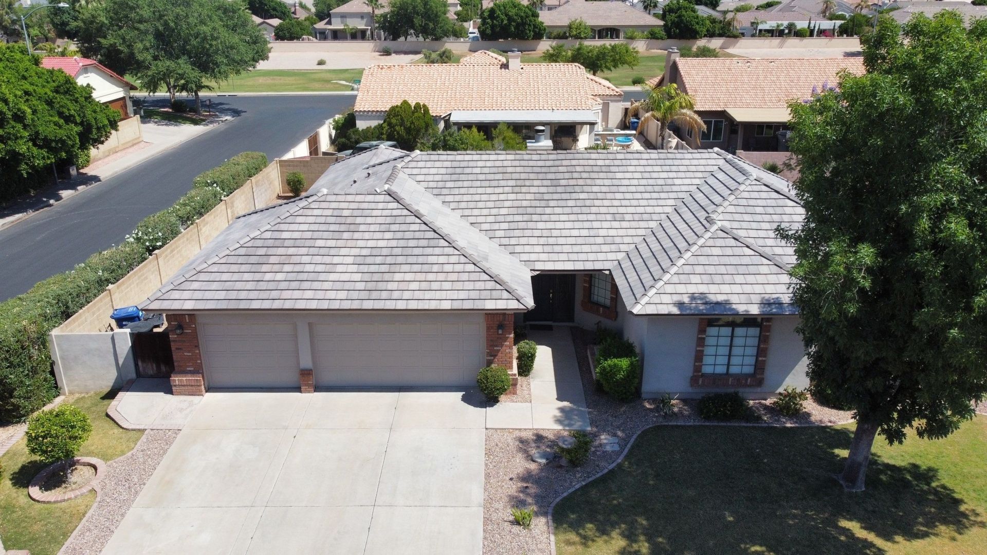 An aerial view of a house in a residential area
