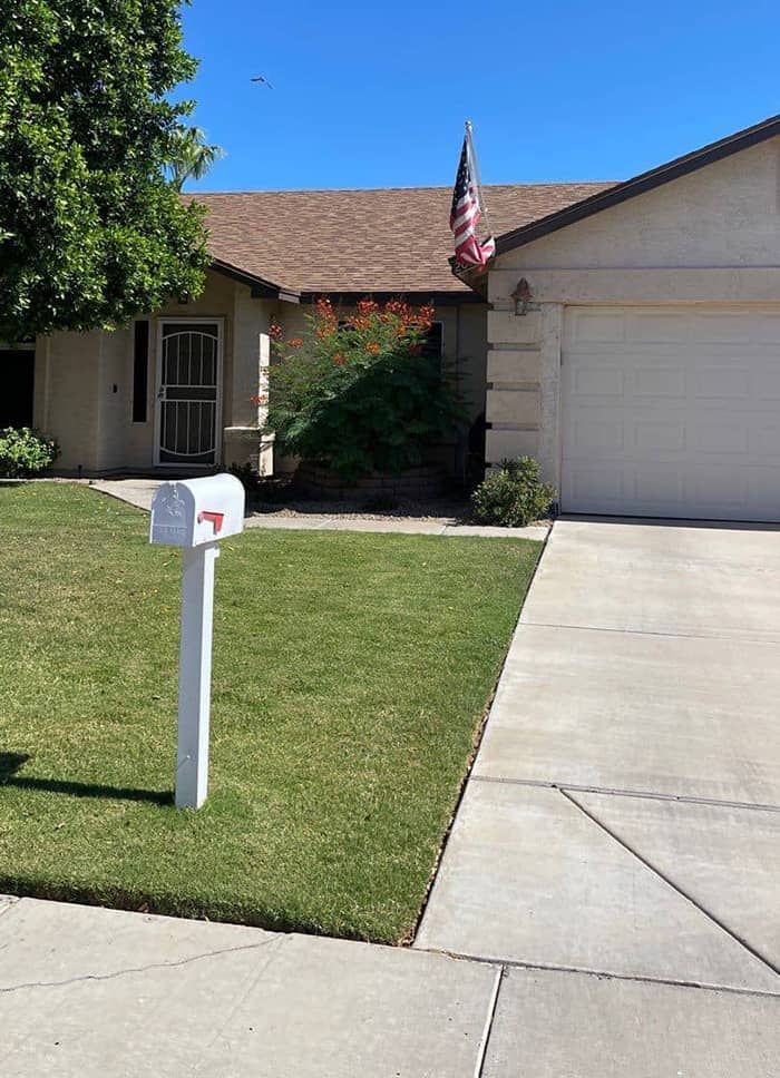 A house with a mailbox in front of it
