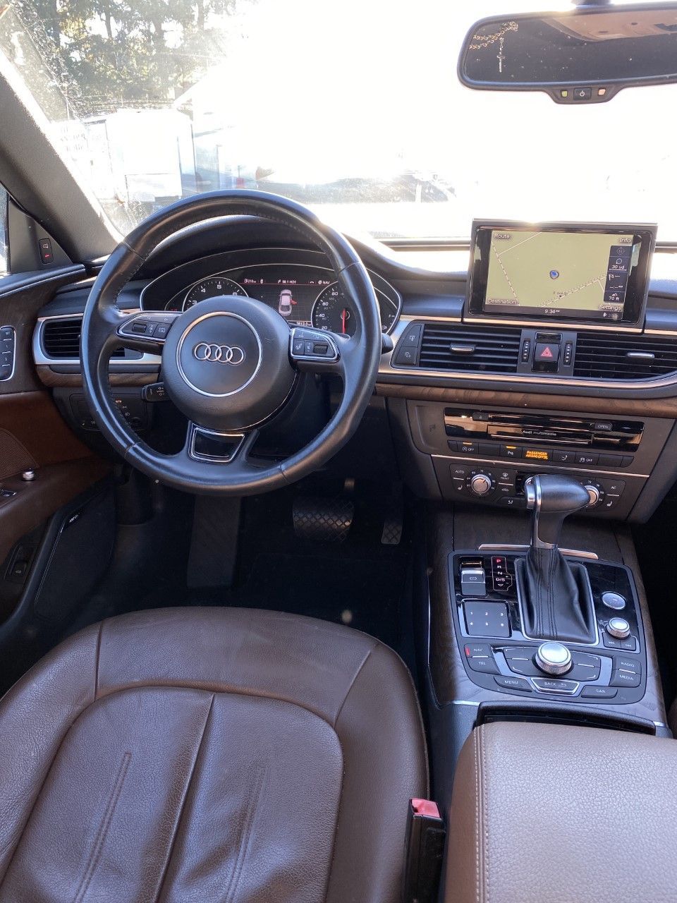 The interior of a car with a steering wheel and a navigation system. | InTown Auto Care