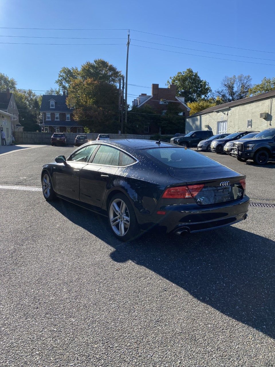 A black audi a7 is parked in a parking lot. | InTown Auto Care