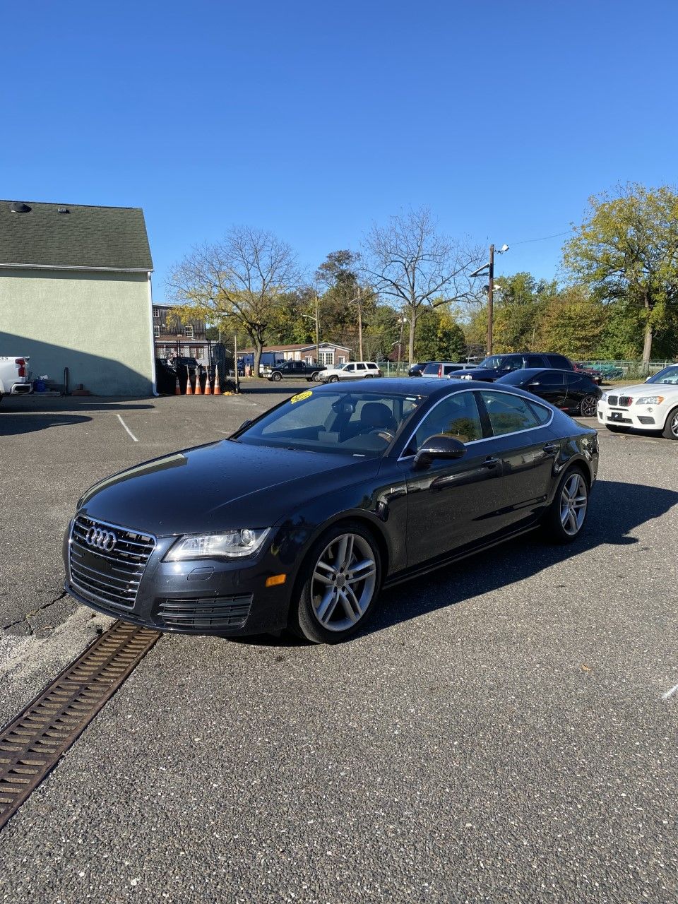 A black audi a7 is parked in a parking lot. | InTown Auto Care