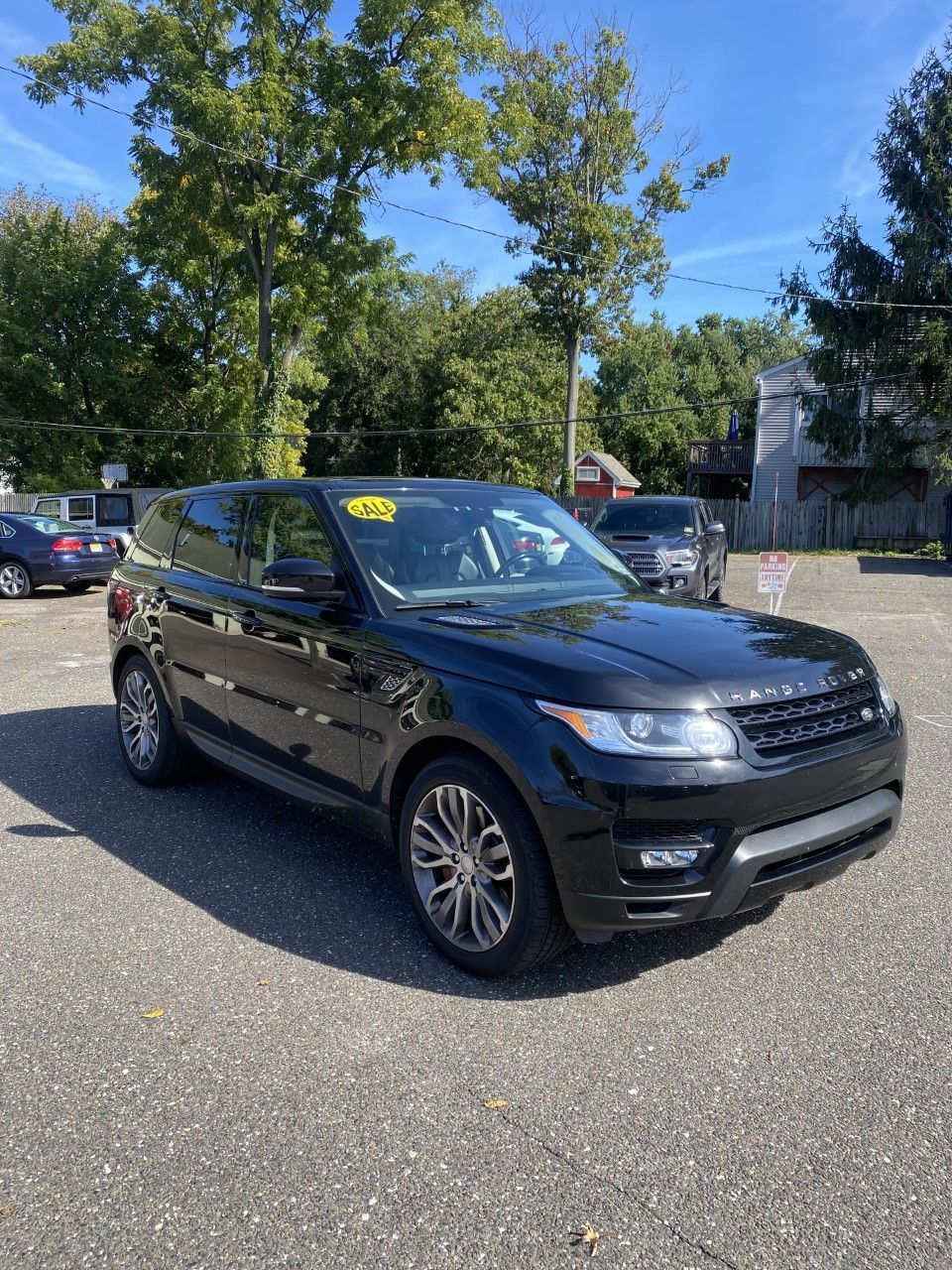 A black range rover sport is parked in a parking lot. | InTown Auto Care