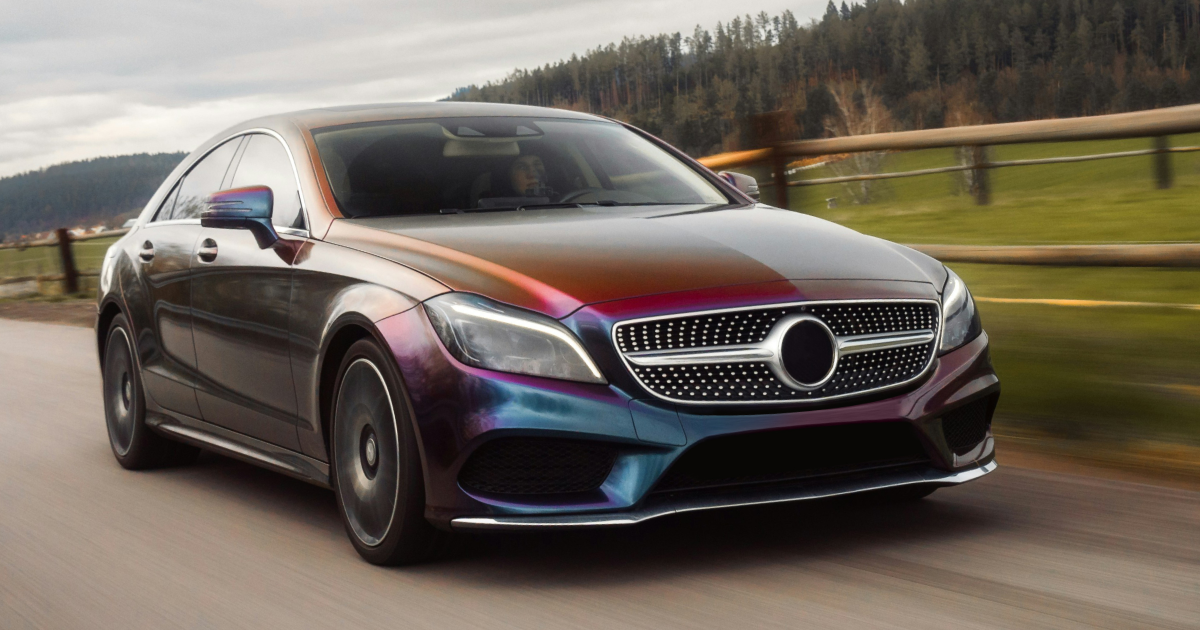 A mercedes benz cls is driving down a road. | InTown Auto Care