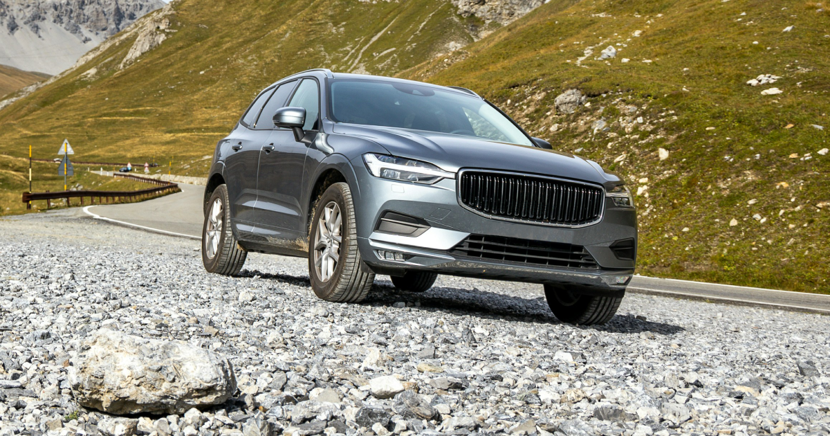 A volvo xc60 is driving down a gravel road. | InTown Auto Care