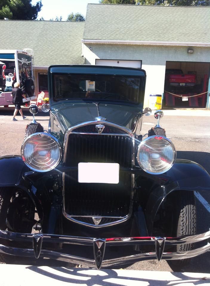 A Black Vintage Vehicle is Parked in Front of InTown Auto Care