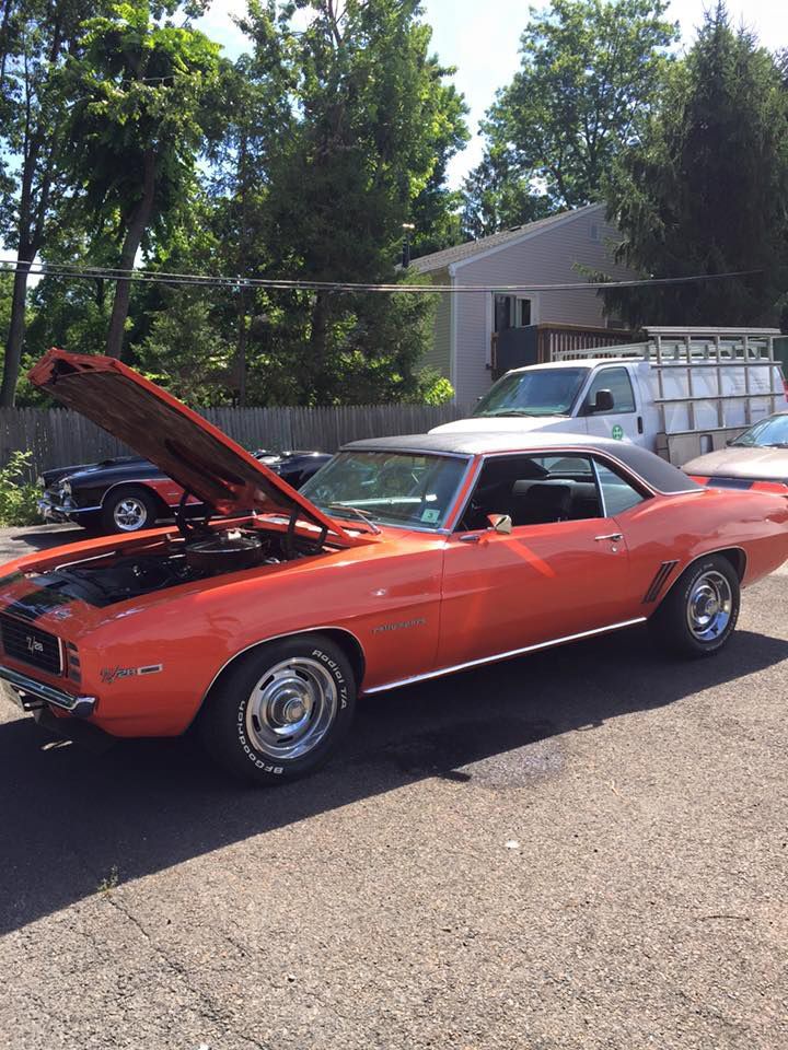 Retro Vehicle With Opened Hood is Parked Nearby InTown Auto Care