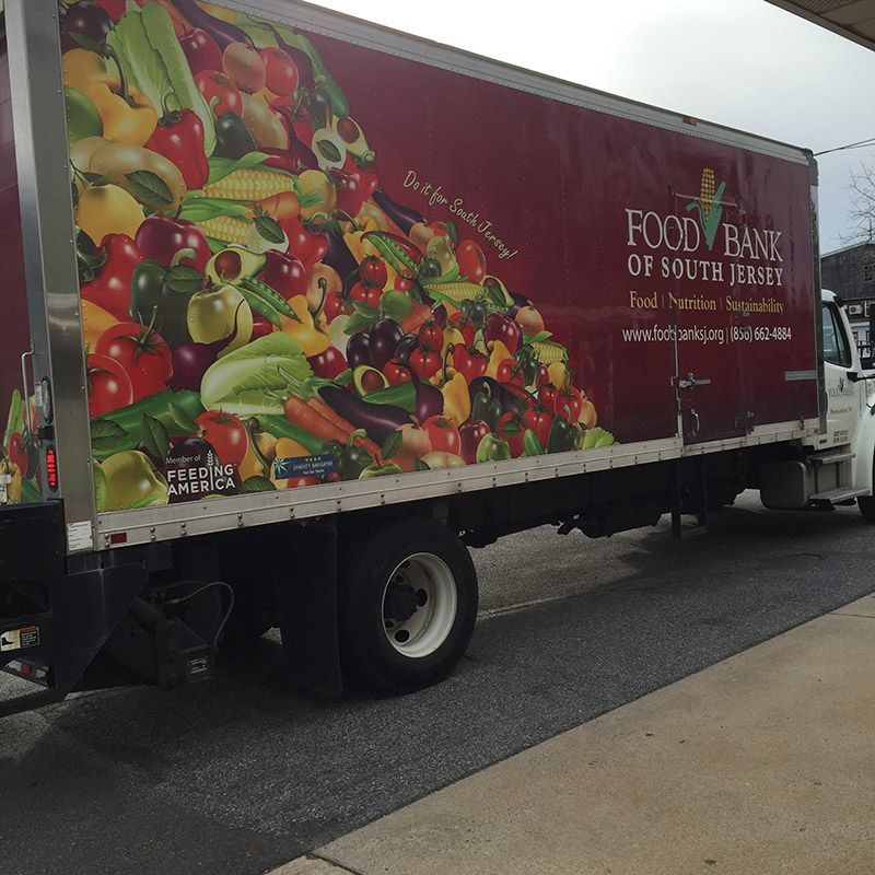 A food bank truck is parked on the side of the road | InTown Auto Care