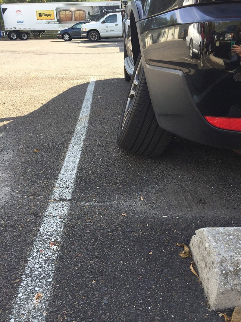 A Car With a Broken Wheel is Stopped in a Parking Lot in Moorestown, NJ - InTown Auto Care