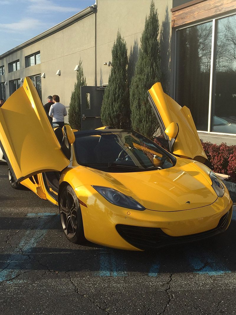 A Yellow Sports Car with Opened Doors is Stopped in Parking a Lot in Moorestown, NJ - InTown Auto Care