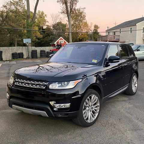 A black range rover sport is parked in a parking lot. | InTown Auto Care