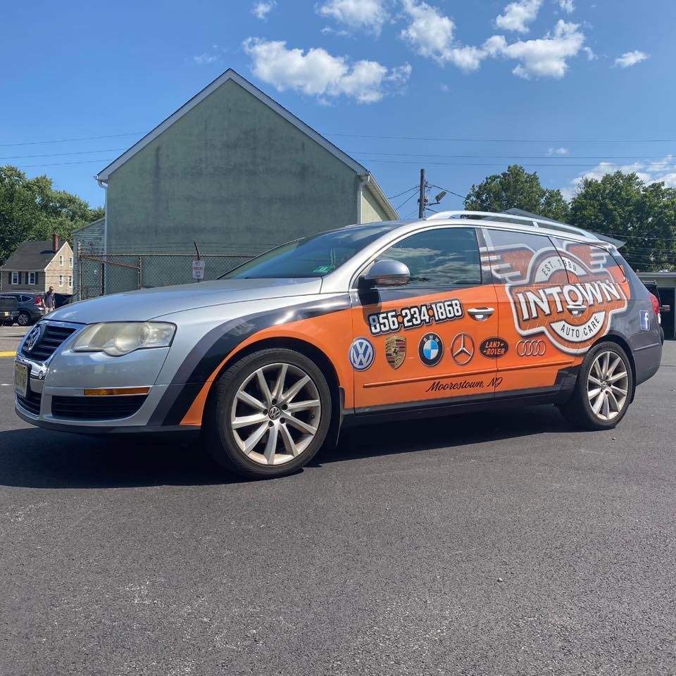 A car that says courtney shuttle is parked in a parking lot | InTown Auto Care