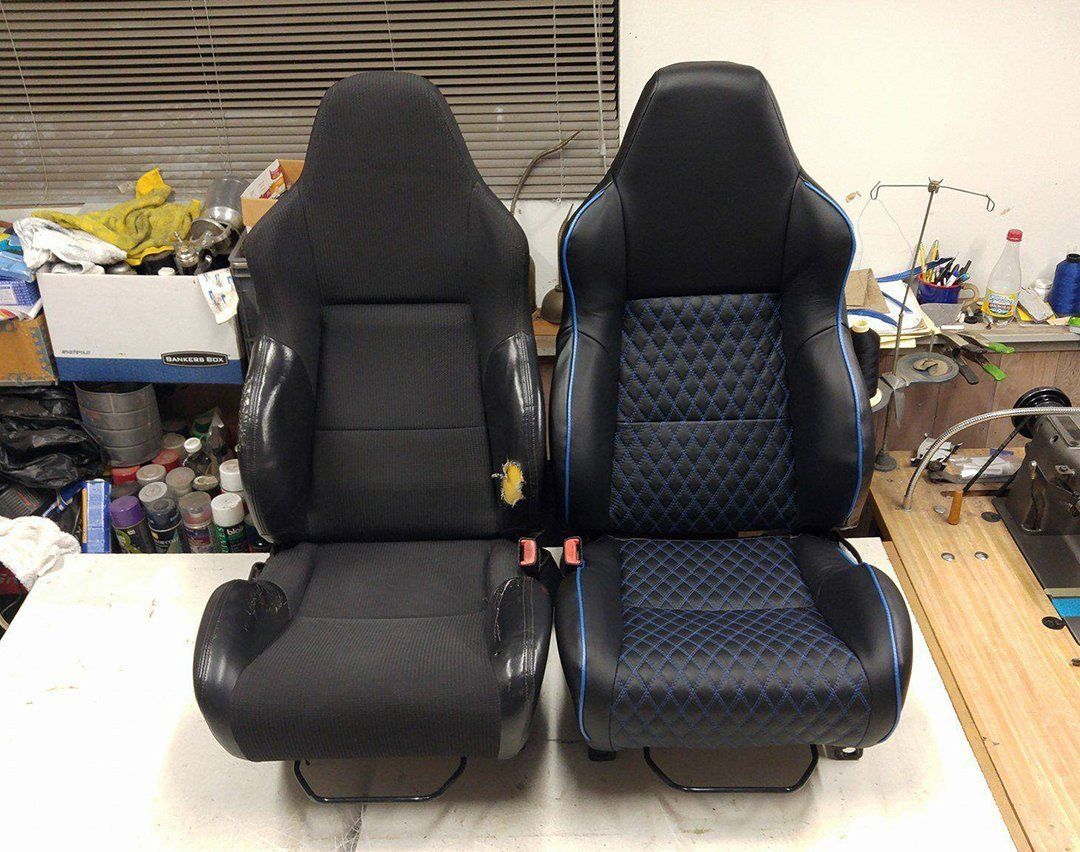 A pair of black and blue seats are sitting on a table