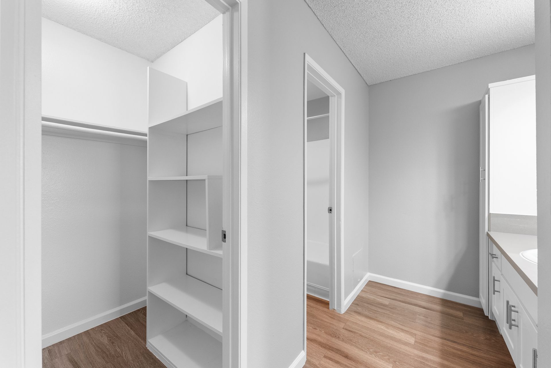 There is a walk in closet in the middle of the room.