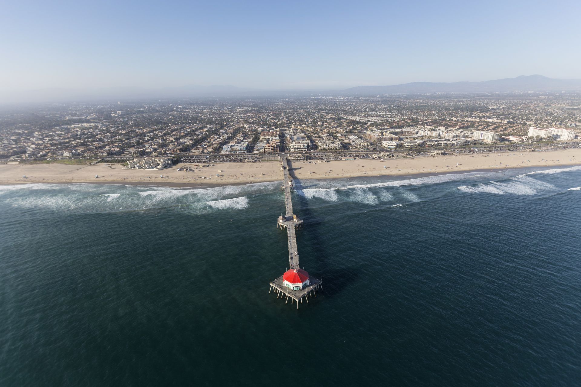 Aerial view of the Huntington Beach Pier and ocean