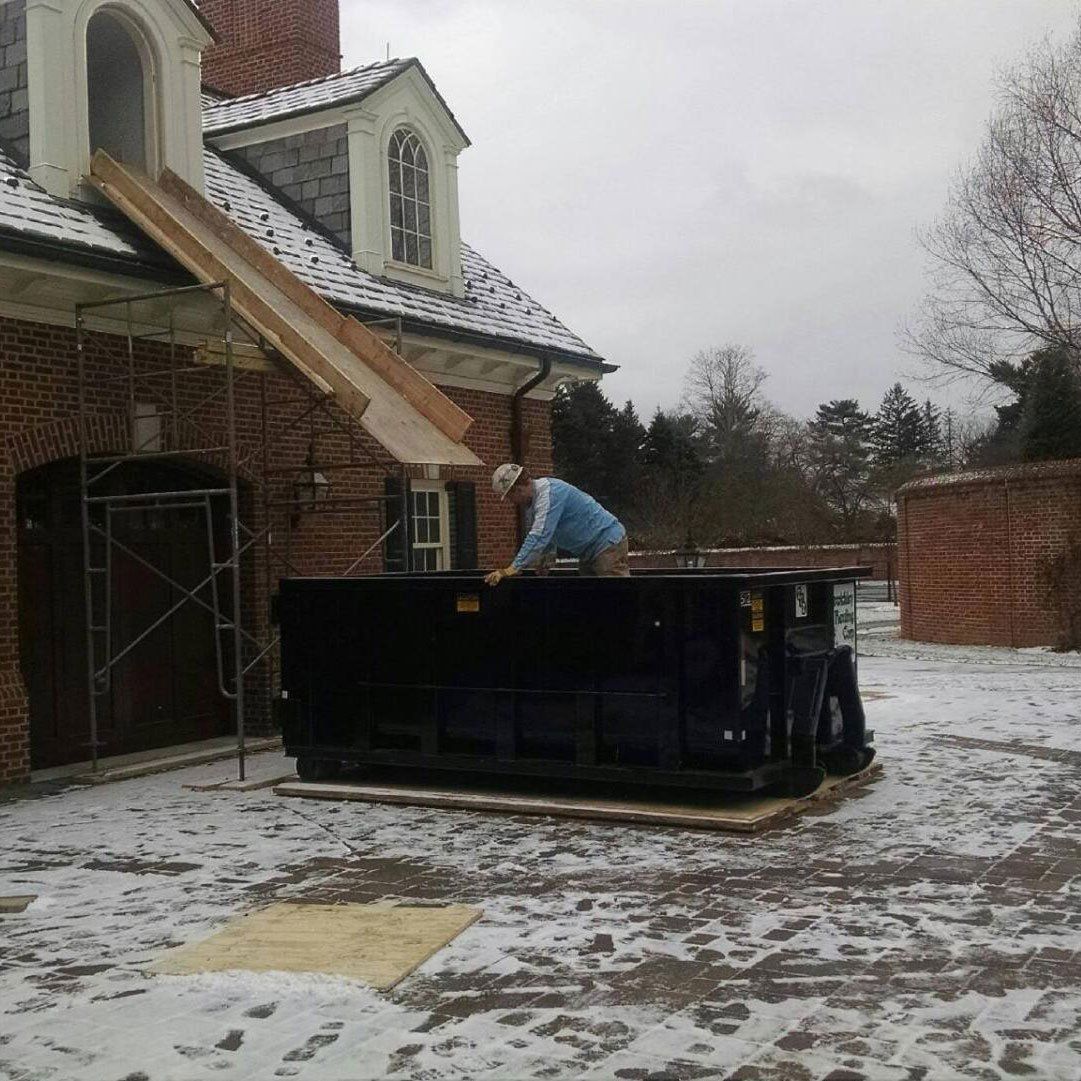 A construction site dumpster rental at a home in Ambridge, PA