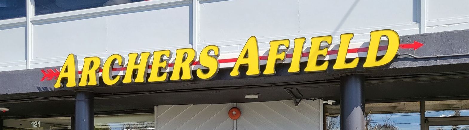 A bunch of arrows in a wall arrows holder