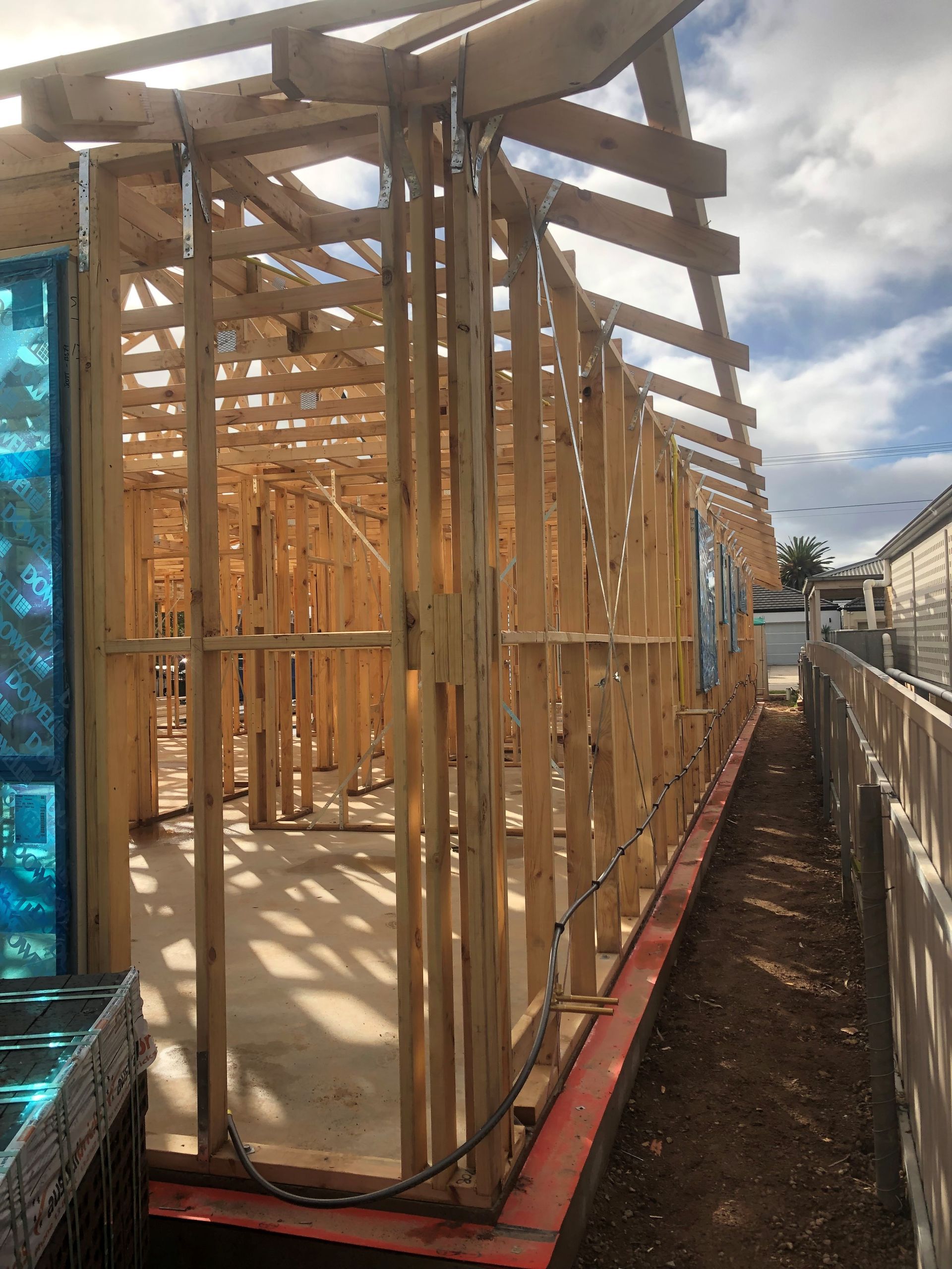 A kitchen with pink cabinets and a white refrigerator