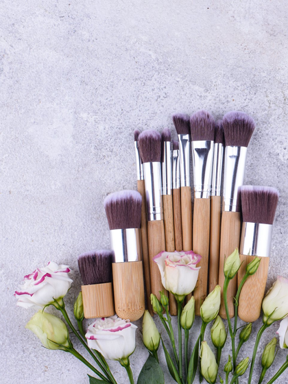 makeup brushes and roses flat lay