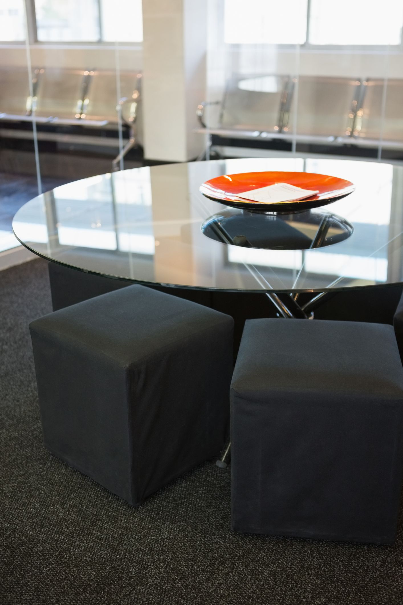 A glass table with a bowl on top of it