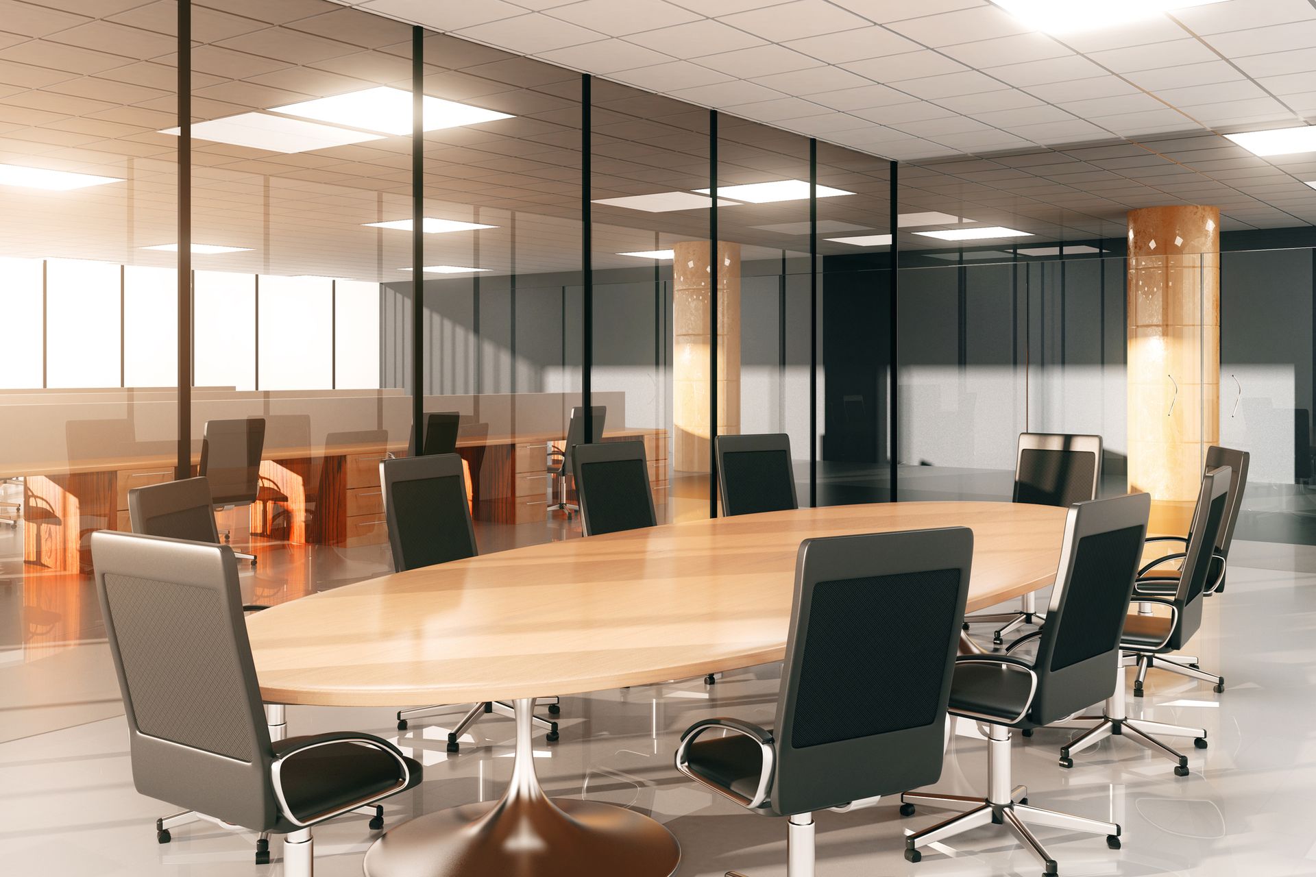 A conference room with a long wooden table and chairs.