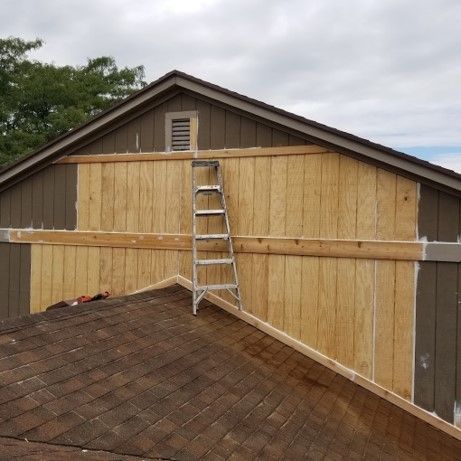 A Ladder Is Attached to The Side of A Building - Bellbrook, OH - John Henry Painting LLC