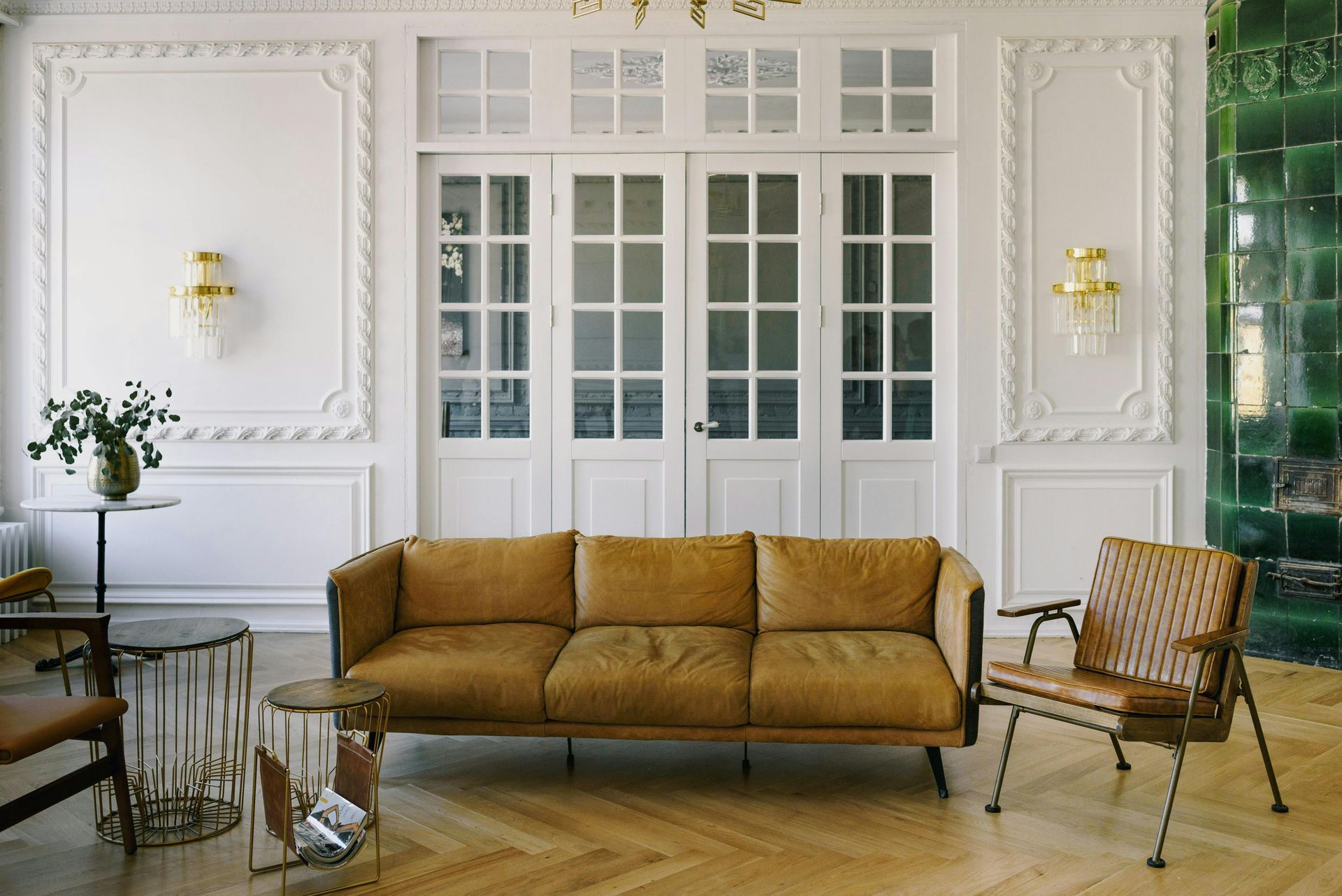 A modern living room with decorative molding and custom wall treatment
