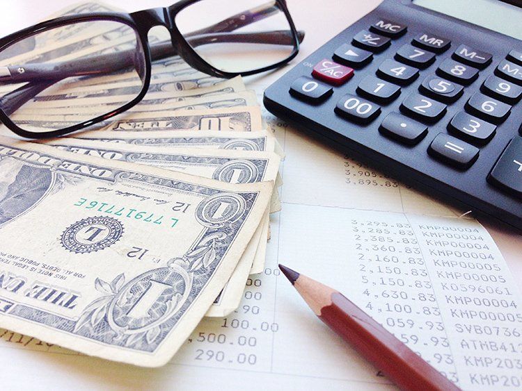 Money, Calculator and Financial Statement — Slidell, LA — Key Credit Inc.