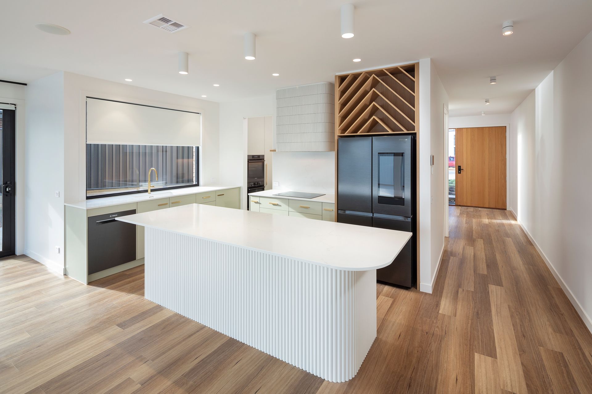 There is a large island in the middle of the kitchen.