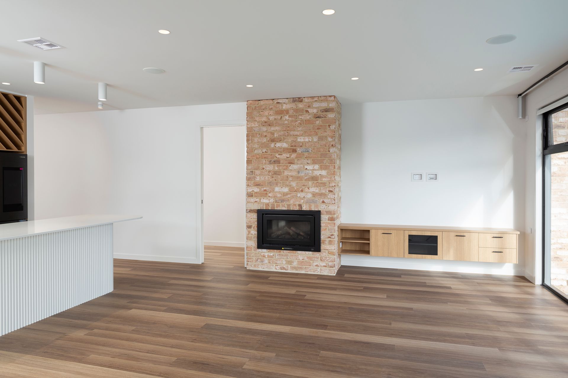 There is a fireplace in the middle of the room.